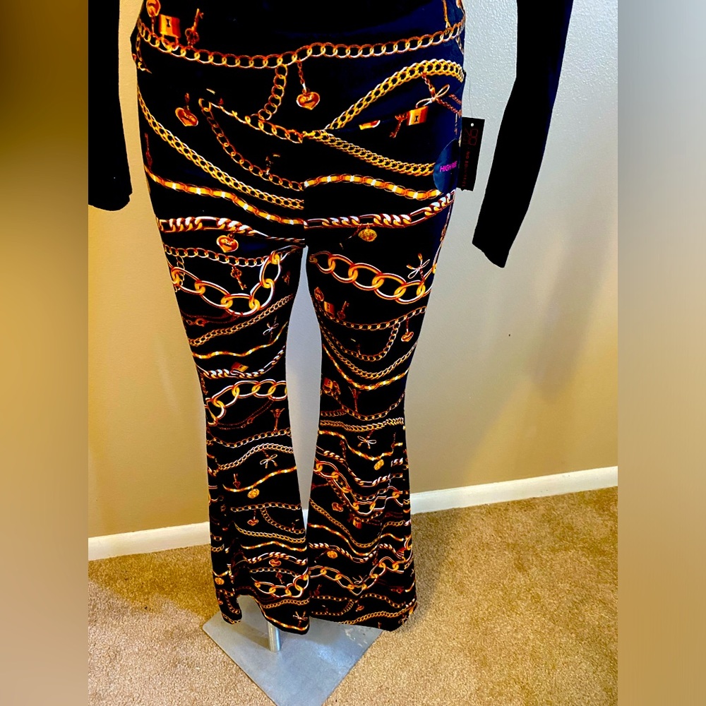 Black and Gold flare legs pants fit the waist size 11/13